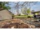 Private backyard with mature trees and storage shed, ideal for outdoor relaxation and activities at 2034 Milburn Dr, Brownsburg, IN 46112