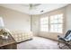 Sunlit bedroom with two windows, soft carpet, and calming decor for peaceful relaxation at 2034 Milburn Dr, Brownsburg, IN 46112