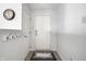 Bright entryway featuring a white door, coat rack, stylish flooring, and clock at 2034 Milburn Dr, Brownsburg, IN 46112