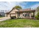 Charming brick home featuring a two-car garage, covered porch, and well-maintained lawn at 2034 Milburn Dr, Brownsburg, IN 46112