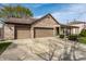 Charming brick home featuring a two-car garage, covered porch, and well-maintained lawn at 2034 Milburn Dr, Brownsburg, IN 46112