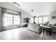 Bright living room with vaulted ceiling, wood-burning stove, and large windows at 2034 Milburn Dr, Brownsburg, IN 46112