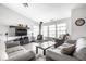 Cozy living room with wood-burning stove, hardwood floors, and comfortable seating at 2034 Milburn Dr, Brownsburg, IN 46112