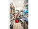 Walk-in pantry with floor to ceiling metal shelving and wood flooring at 2034 Milburn Dr, Brownsburg, IN 46112