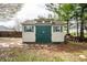 Backyard shed with double doors, offering practical storage and yard equipment space at 2034 Milburn Dr, Brownsburg, IN 46112