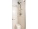 Tile shower with a detachable shower head and built-in shelves for optimal bathing experience at 2034 Milburn Dr, Brownsburg, IN 46112