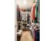 Well-organized walk-in closet with shelving for shoes and hanging space for clothing at 2034 Milburn Dr, Brownsburg, IN 46112