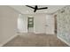 Bright bedroom with modern ceiling fan, access to updated bathroom, and neutral color palette at 2103 Postmaster Ln, Greenfield, IN 46140