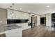 Modern kitchen with white cabinets, granite countertops, stainless steel appliances, and hardwood floors at 2103 Postmaster Ln, Greenfield, IN 46140