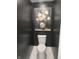 Elegant powder room featuring white toilet and decorative painting, offering a touch of sophistication at 2103 Postmaster Ln, Greenfield, IN 46140