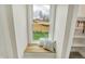 Charming window seat with plush cushions, natural light, and built-in shelving for storage at 2103 Postmaster Ln, Greenfield, IN 46140