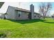 Large, well-maintained backyard with a view of the house, sliding door, and green lawn at 2206 Tansel Crossing Cir, Indianapolis, IN 46234