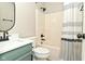 This renovated bathroom features a modern vanity, and a shower/tub combo at 2206 Tansel Crossing Cir, Indianapolis, IN 46234