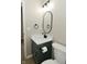 Updated bathroom featuring a modern vanity with an oval mirror and updated fixtures at 2206 Tansel Crossing Cir, Indianapolis, IN 46234