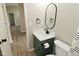 Updated bathroom with a modern vanity, stylish mirror, and updated fixtures at 2206 Tansel Crossing Cir, Indianapolis, IN 46234