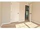 Bright bedroom featuring neutral walls, wood-look flooring and white doors at 2206 Tansel Crossing Cir, Indianapolis, IN 46234