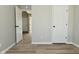 Bedroom featuring neutral walls, wood-look flooring and multiple doorways at 2206 Tansel Crossing Cir, Indianapolis, IN 46234