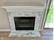 Close-up of the stylish fireplace with marble tile surround, a focal point of the living space at 2206 Tansel Crossing Cir, Indianapolis, IN 46234