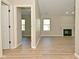Bright living room with wood flooring and a fireplace, offering a cozy atmosphere at 2206 Tansel Crossing Cir, Indianapolis, IN 46234