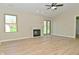Open-concept living room with vaulted ceiling, fireplace, and sliding glass door, perfect for entertaining at 2206 Tansel Crossing Cir, Indianapolis, IN 46234