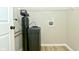 Utility room with water filtration system and wire rack shelving at 2206 Tansel Crossing Cir, Indianapolis, IN 46234