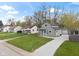 Neighborhood street view featuring a renovated home with a crushed gravel driveway at 2249 N Centennial St, Indianapolis, IN 46222