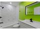 Vibrant bathroom with modern fixtures, white vanity, and tiled shower/tub combination at 2249 N Centennial St, Indianapolis, IN 46222