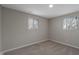 Bedroom with neutral walls and carpet with two windows providing bright, natural light at 2249 N Centennial St, Indianapolis, IN 46222