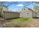 Exterior view of home with a detached garage and a lawn at 2249 N Centennial St, Indianapolis, IN 46222