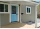 Covered front porch with a modern door and plenty of natural light at 2249 N Centennial St, Indianapolis, IN 46222