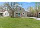 Charming home with a blue front door and a spacious green lawn at 2249 N Centennial St, Indianapolis, IN 46222