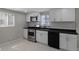 Updated kitchen features stainless appliances, white cabinets and modern subway backsplash at 2249 N Centennial St, Indianapolis, IN 46222
