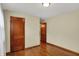 This bedroom features hardwood flooring, neutral-toned walls, and traditional wood trim at 2330 Harlan St, Indianapolis, IN 46203