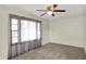 Comfortable bedroom with soft carpet, a lighted ceiling fan, and good natural light at 2330 Harlan St, Indianapolis, IN 46203