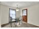 Dining room features a glass table with metal chairs and a pendant light fixture at 2330 Harlan St, Indianapolis, IN 46203