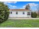 Lovely one-story home with a bright white exterior and manicured front yard at 2330 Harlan St, Indianapolis, IN 46203