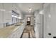 Cozy kitchen with white cabinetry, stainless steel sink, and a view to the dining area at 2330 Harlan St, Indianapolis, IN 46203