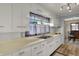 Well-lit kitchen featuring stainless steel double sink and ample cabinet space at 2330 Harlan St, Indianapolis, IN 46203