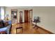 View of the living room featuring hardwood floors, neutral paint colors, and ample natural light at 2330 Harlan St, Indianapolis, IN 46203