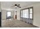 Cozy living room featuring a ceiling fan and a separate dining area with bright, natural light at 2330 Harlan St, Indianapolis, IN 46203
