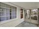 View of porch with screen door and large windows at 2330 Harlan St, Indianapolis, IN 46203