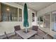 Sunroom with table and chairs under a large umbrella at 2330 Harlan St, Indianapolis, IN 46203