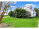 View of property with lawn, greenery and partial home view on a clear day at 2330 Harlan St, Indianapolis, IN 46203