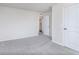 Clean bedroom featuring gray carpeting, white walls, and a closet at 2741 Penn Ave, Plainfield, IN 46168