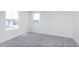Bright bedroom with plush carpeting, two windows, and neutral paint at 2741 Penn Ave, Plainfield, IN 46168