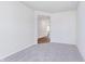 Comfortable carpeted bedroom showcasing a doorway and neutral color palette at 2741 Penn Ave, Plainfield, IN 46168
