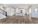 Modern kitchen featuring white cabinets, an island with sink, stainless appliances and wood-look floors at 2741 Penn Ave, Plainfield, IN 46168