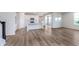 Open-concept kitchen with white cabinets, stainless steel appliances, and an island with a sink at 2741 Penn Ave, Plainfield, IN 46168