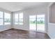 Bright living room with large windows and sliding glass doors leading to the backyard at 2741 Penn Ave, Plainfield, IN 46168