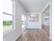 Bright living room features hardwood floors, large windows, and an open floor plan at 2741 Penn Ave, Plainfield, IN 46168